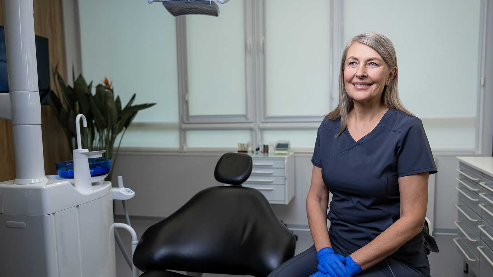 Lady dentist smiling in clinic
