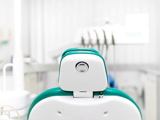 The back of a dental chair in a dental clinic room
